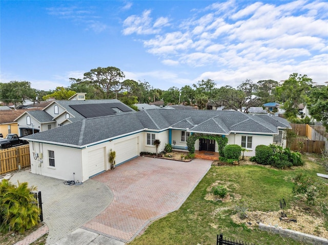 1828 Mova St, Sarasota, FL 34231 - ranch-style home featuring a garage, decorative driveway, stucco siding, and a shingled roof