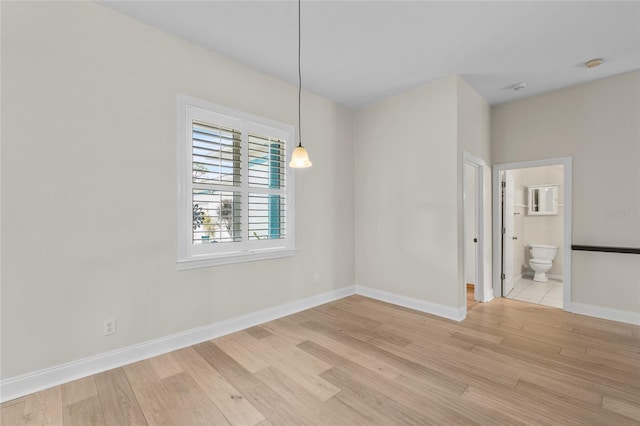 1828 Mova St, Sarasota, FL 34231 - empty room with light wood-type flooring and baseboards