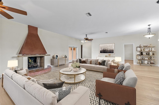 1828 Mova St, Sarasota, FL 34231 - living area with a ceiling fan, light wood-type flooring, and a large fireplace