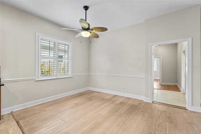 1828 Mova St, Sarasota, FL 34231 - unfurnished room featuring light wood-style flooring, a ceiling fan, and baseboards