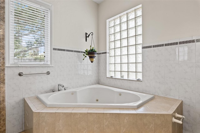 1828 Mova St, Sarasota, FL 34231 - bathroom with a jetted tub, plenty of natural light, and tile walls