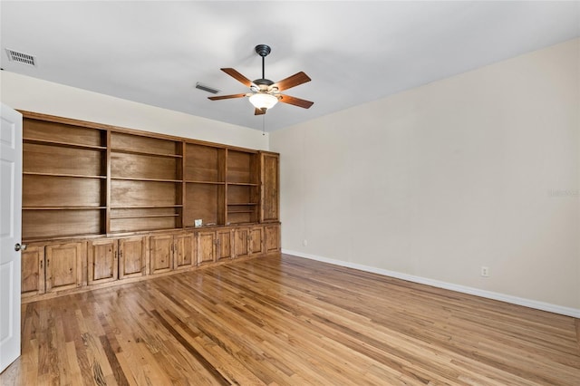 1828 Mova St, Sarasota, FL 34231 - empty room featuring wood finished floors, ceiling fan, and baseboards