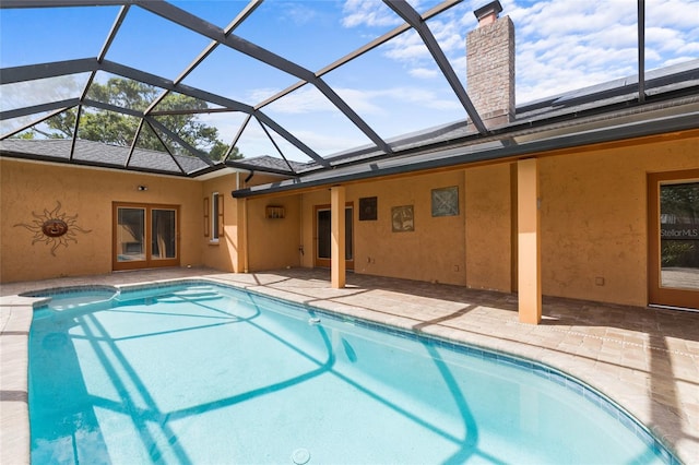 1828 Mova St, Sarasota, FL 34231 - outdoor pool with french doors, a patio area, and a lanai