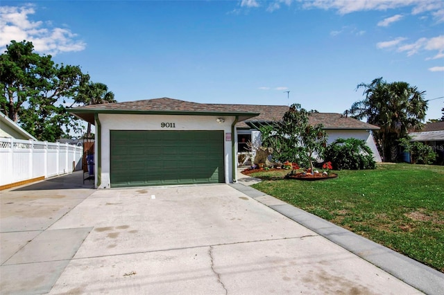 9011 Hilolo Ln, Venice, FL 34293 - ranch-style home featuring a garage, stucco siding, a front yard, fence, and driveway