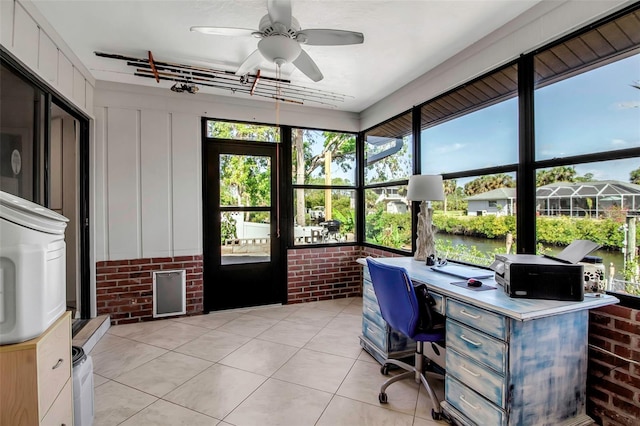 9011 Hilolo Ln, Venice, FL 34293 - office space featuring brick wall, light tile patterned floors, and a ceiling fan