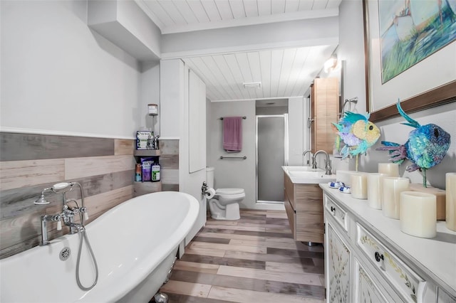 9011 Hilolo Ln, Venice, FL 34293 - bathroom featuring wooden ceiling, a soaking tub, vanity, wood finished floors, and a stall shower