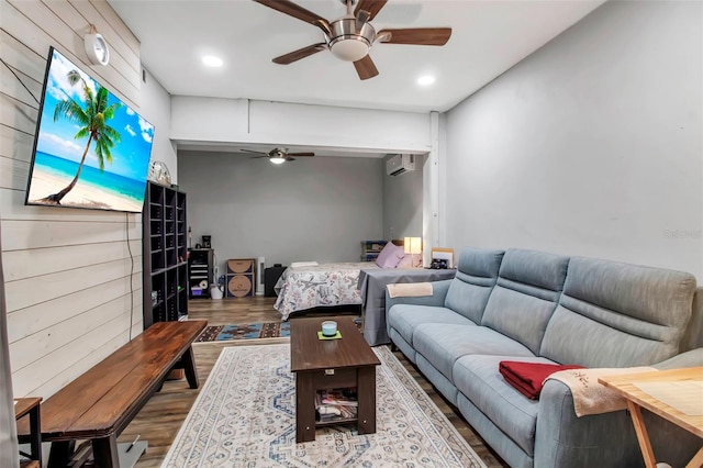 9011 Hilolo Ln, Venice, FL 34293 - living area featuring a wall mounted air conditioner, recessed lighting, wood finished floors, and ceiling fan