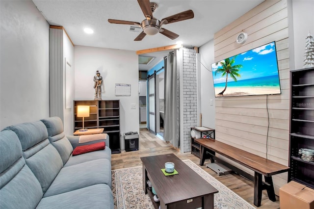 9011 Hilolo Ln, Venice, FL 34293 - living area with light wood-type flooring and ceiling fan