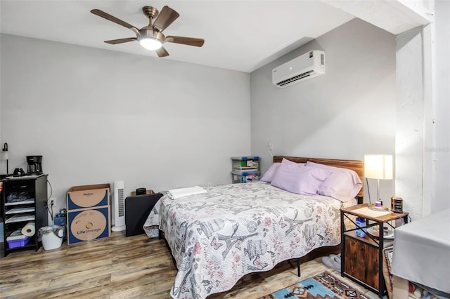 9011 Hilolo Ln, Venice, FL 34293 - bedroom with a wall mounted air conditioner, a ceiling fan, and wood finished floors