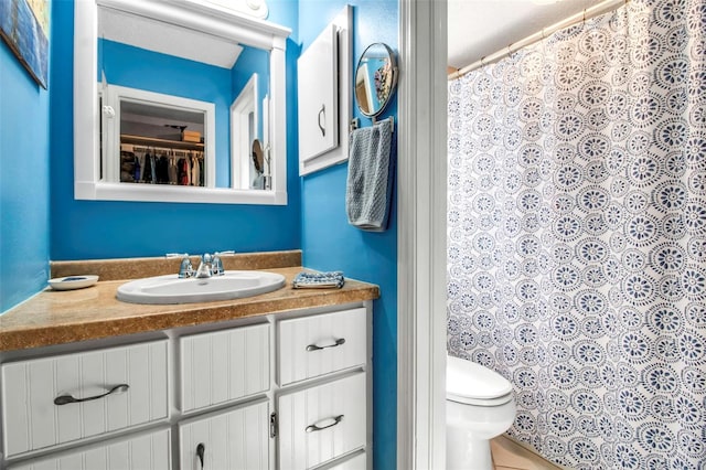 9011 Hilolo Ln, Venice, FL 34293 - bathroom featuring toilet, vanity, and a shower with curtain
