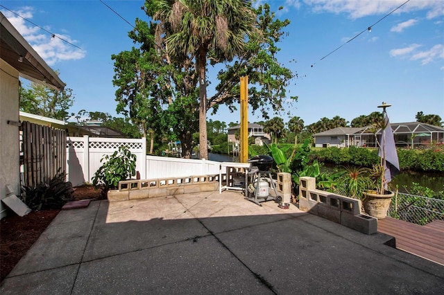 9011 Hilolo Ln, Venice, FL 34293 - view of patio featuring a water view and fence
