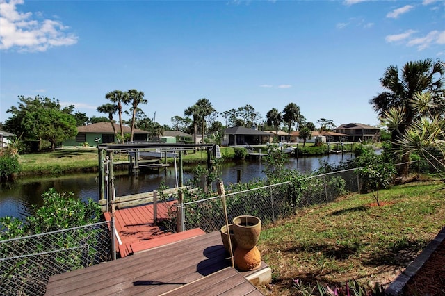 9011 Hilolo Ln, Venice, FL 34293 - view of dock with boat lift and a water view