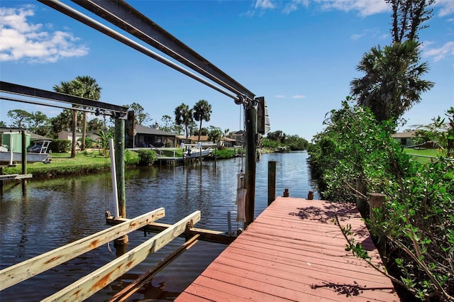 9011 Hilolo Ln, Venice, FL 34293 - view of dock with a water view and boat lift