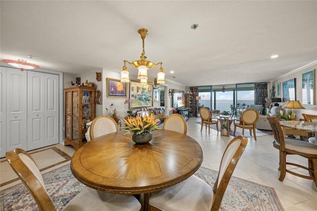 dining room featuring a notable chandelier, ornamental molding, recessed lighting, and light tile patterned floors
