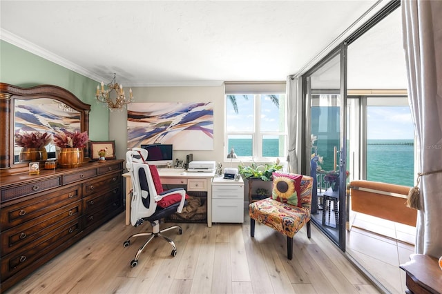 office featuring a notable chandelier, ornamental molding, and light wood finished floors