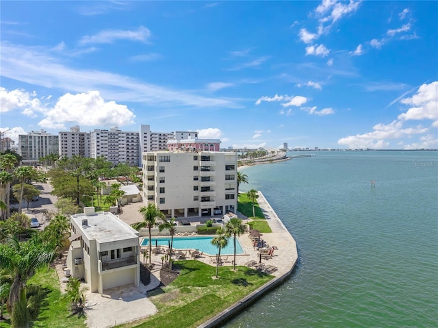 birds eye view of property with a water view and a view of city