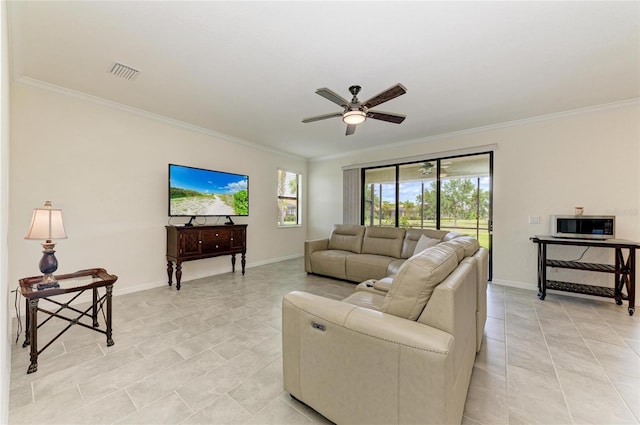 living room featuring baseboards, visible vents, ceiling fan, crown molding, and light tile patterned floors