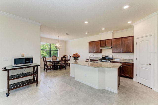 kitchen featuring ornamental molding, a sink, a notable chandelier, and appliances with stainless steel finishes