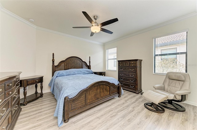bedroom with a ceiling fan, baseboards, crown molding, and light wood-type flooring