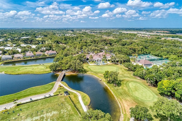 birds eye view of property with a residential view, a water view, and view of golf course