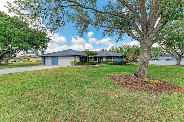 single story home with fence, an attached garage, driveway, and a front yard