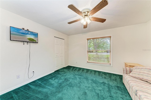 unfurnished bedroom featuring carpet flooring, a ceiling fan, and baseboards