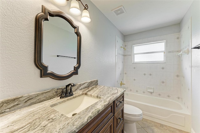 bathroom with shower / bathtub combination, toilet, visible vents, tile patterned floors, and vanity