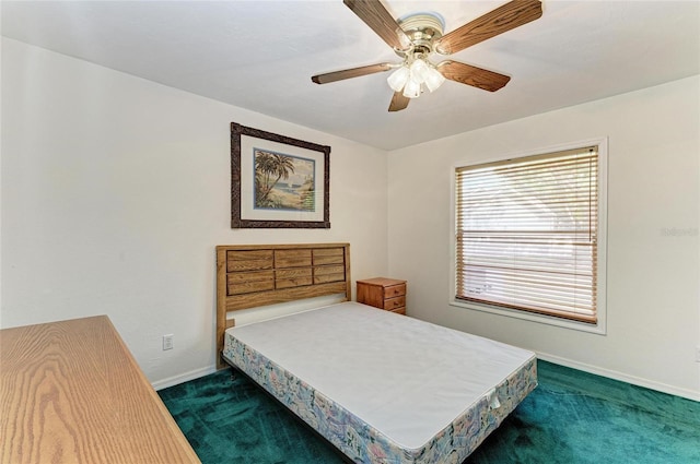 bedroom featuring baseboards, a ceiling fan, and dark carpet