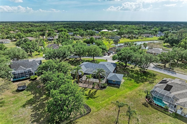 drone / aerial view featuring a water view and a residential view