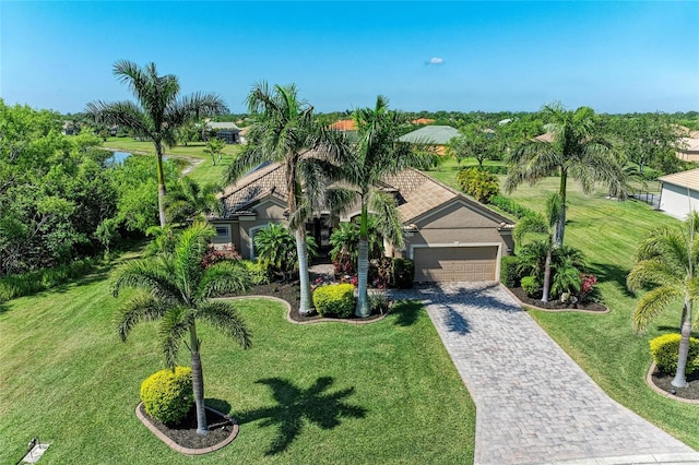 618 148th Ct NE, Bradenton, FL 34212 - view of front of property featuring an attached garage, stucco siding, decorative driveway, and a front yard