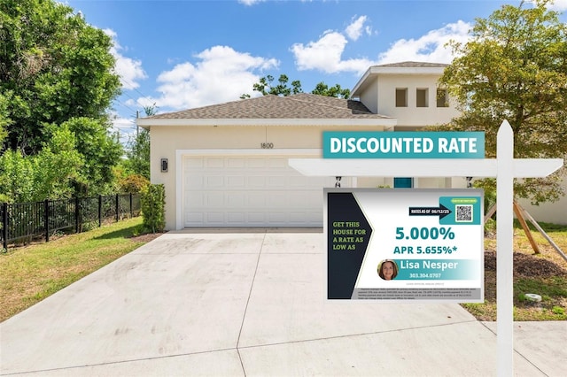 1800 Little Bird Ct, Sarasota, FL 34235 - view of front of house with concrete driveway, stucco siding, and an attached garage