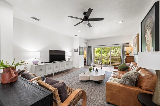 1800 Little Bird Ct, Sarasota, FL 34235 - living area featuring a ceiling fan, wood finished floors, recessed lighting, and a textured ceiling