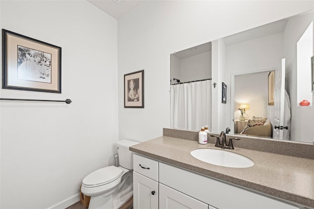 1800 Little Bird Ct, Sarasota, FL 34235 - ensuite bathroom featuring vanity and toilet