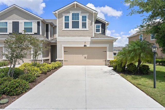 5543 Pleasantview Ct, Bradenton, FL 34211 - view of front of house with an attached garage, driveway, and stone siding