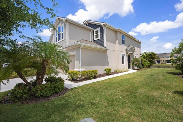 5543 Pleasantview Ct, Bradenton, FL 34211 - view of home's exterior featuring a lawn, an attached garage, and stucco siding