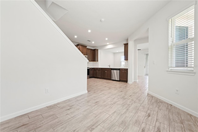 5543 Pleasantview Ct, Bradenton, FL 34211 - unfurnished living room featuring baseboards, recessed lighting, and light wood-style flooring