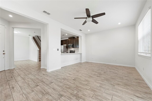 5543 Pleasantview Ct, Bradenton, FL 34211 - unfurnished living room featuring visible vents, stairs, ceiling fan, recessed lighting, and light wood-style flooring