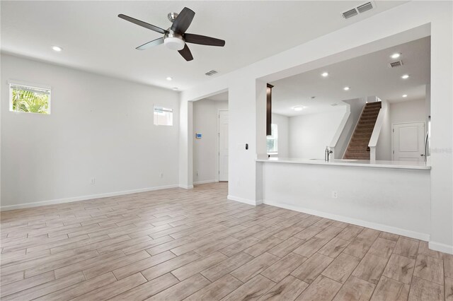 5543 Pleasantview Ct, Bradenton, FL 34211 - unfurnished living room with light wood-style floors, ceiling fan, recessed lighting, and visible vents