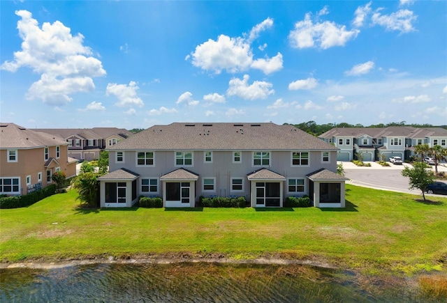 5543 Pleasantview Ct, Bradenton, FL 34211 - rear view of property with a residential view, a yard, a shingled roof, and a sunroom