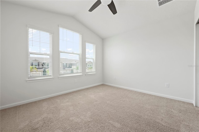 5543 Pleasantview Ct, Bradenton, FL 34211 - spare room with light carpet, a ceiling fan, baseboards, vaulted ceiling, and visible vents