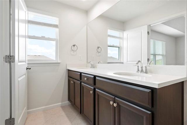 5543 Pleasantview Ct, Bradenton, FL 34211 - bathroom with a sink, double vanity, and a healthy amount of sunlight