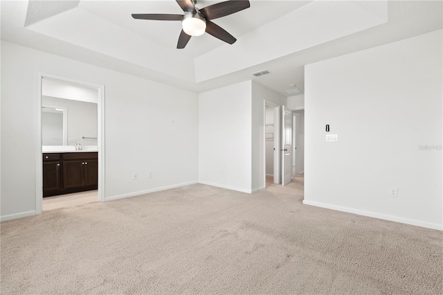 5543 Pleasantview Ct, Bradenton, FL 34211 - spare room with visible vents, baseboards, ceiling fan, light colored carpet, and a raised ceiling