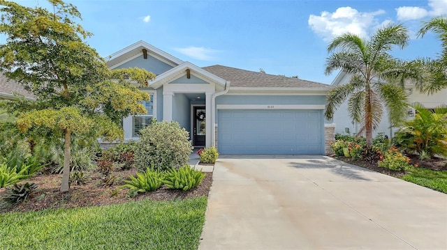8110 Trimbelle Ter, Parrish, FL 34219 - view of front facade with stucco siding, an attached garage, and concrete driveway