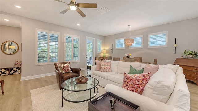 8110 Trimbelle Ter, Parrish, FL 34219 - living area featuring light wood-style floors, a ceiling fan, and recessed lighting