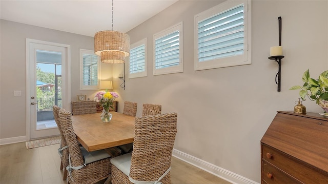 8110 Trimbelle Ter, Parrish, FL 34219 - dining area with light wood-type flooring and a chandelier