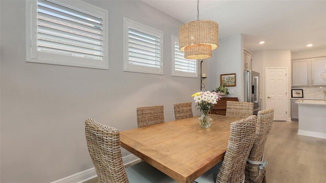 8110 Trimbelle Ter, Parrish, FL 34219 - dining area featuring light wood-type flooring, recessed lighting, and a chandelier