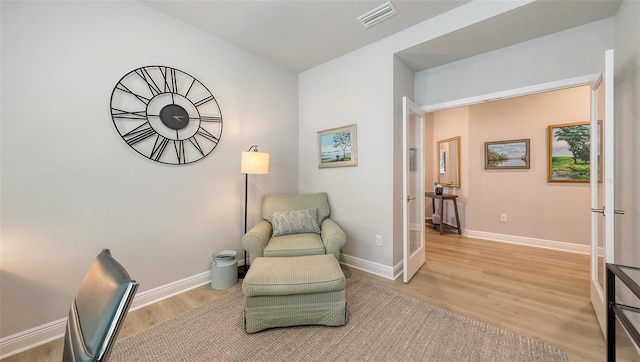 8110 Trimbelle Ter, Parrish, FL 34219 - living area with light wood finished floors and french doors