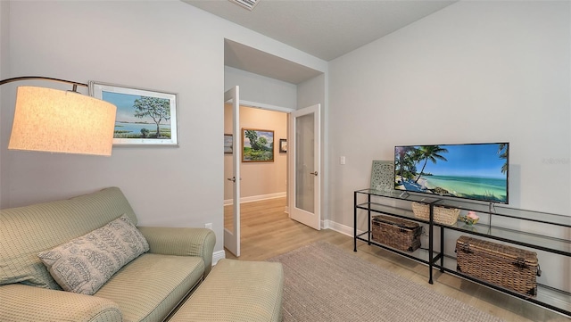 8110 Trimbelle Ter, Parrish, FL 34219 - living room with wood finished floors and french doors