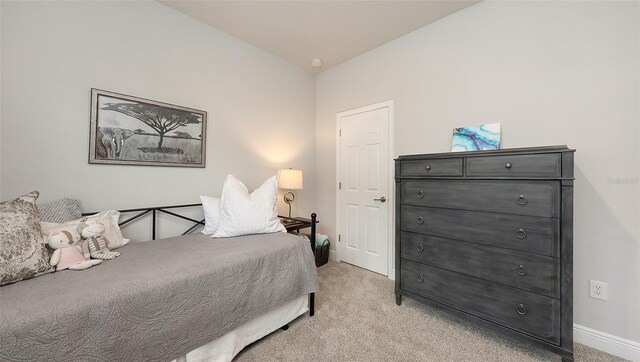 8110 Trimbelle Ter, Parrish, FL 34219 - bedroom with light carpet and baseboards