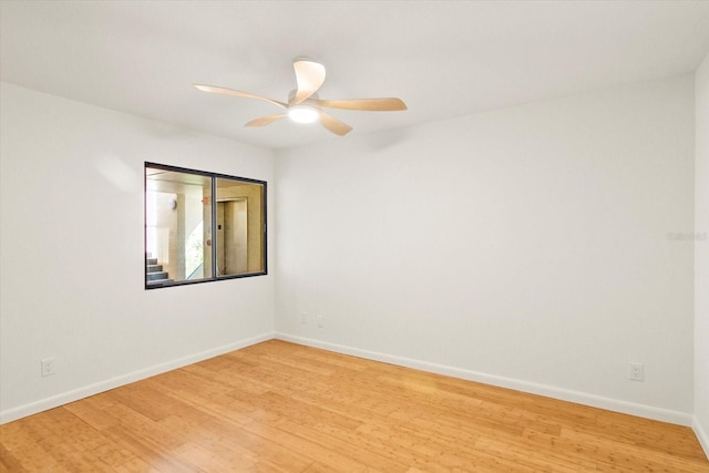 825 S Osprey Ave Unit 302, Sarasota, FL 34236 - empty room with light wood finished floors, baseboards, and ceiling fan